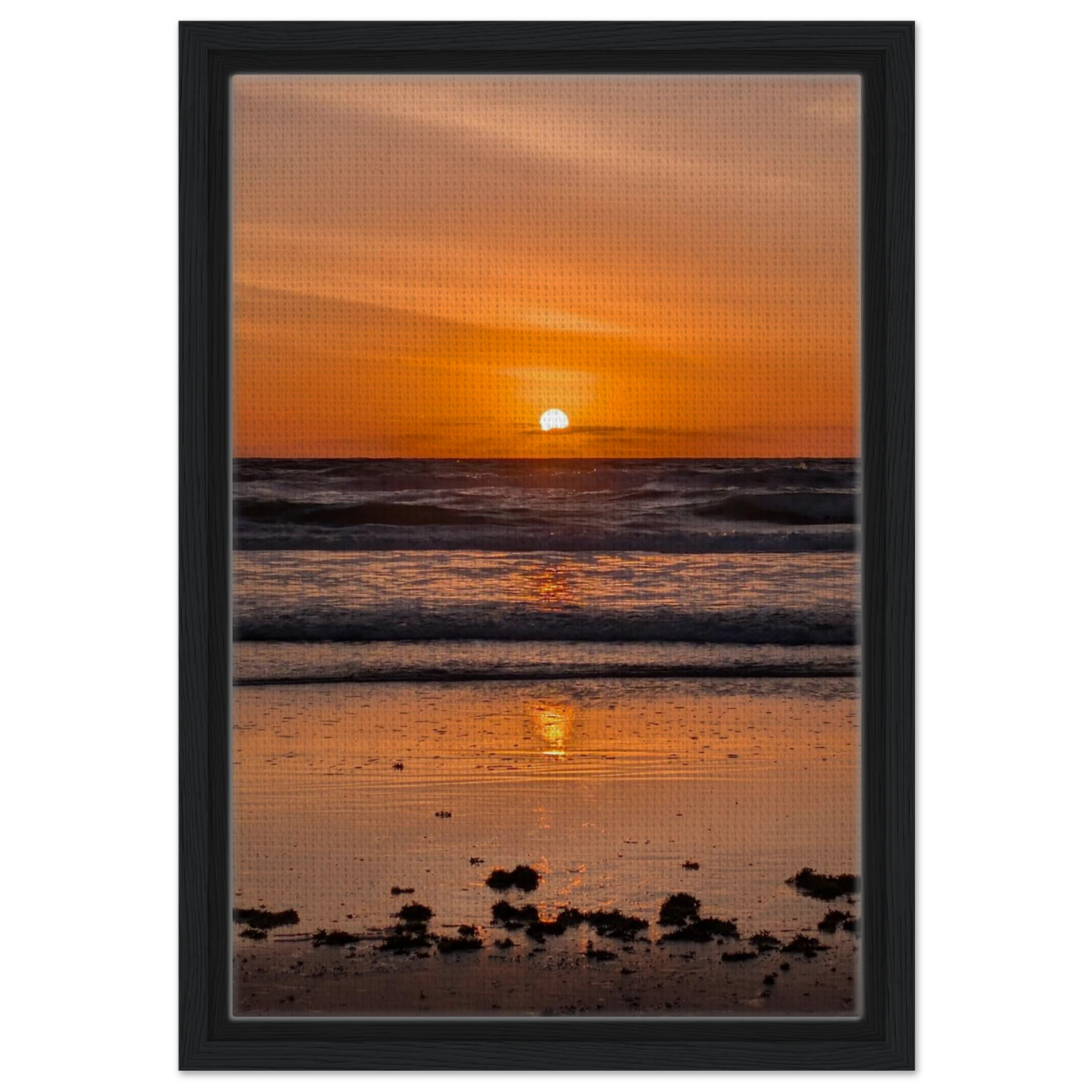 Orange sunrise reflecting across the shoreline at Vilano Beach Florida.