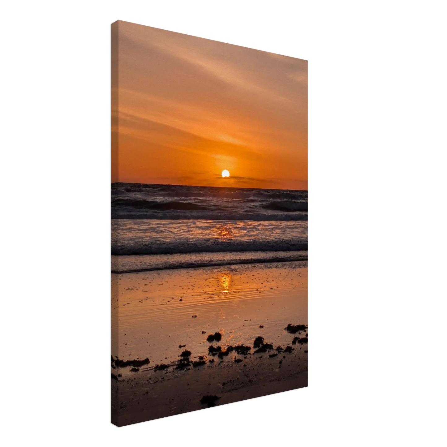 Orange sunrise reflecting across the shoreline at Vilano Beach Florida.