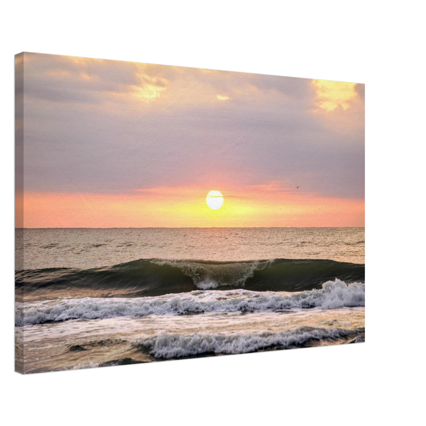Ocean wave breaking beneath a colorful sunrise at Vilano Beach Florida.