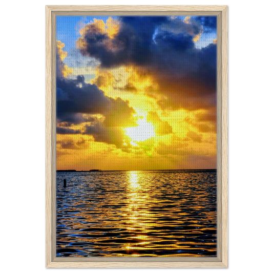 Golden sunset breaking through dramatic clouds over Crystal Beach in Palm Harbor, Florida, with light reflecting across Gulf waters.