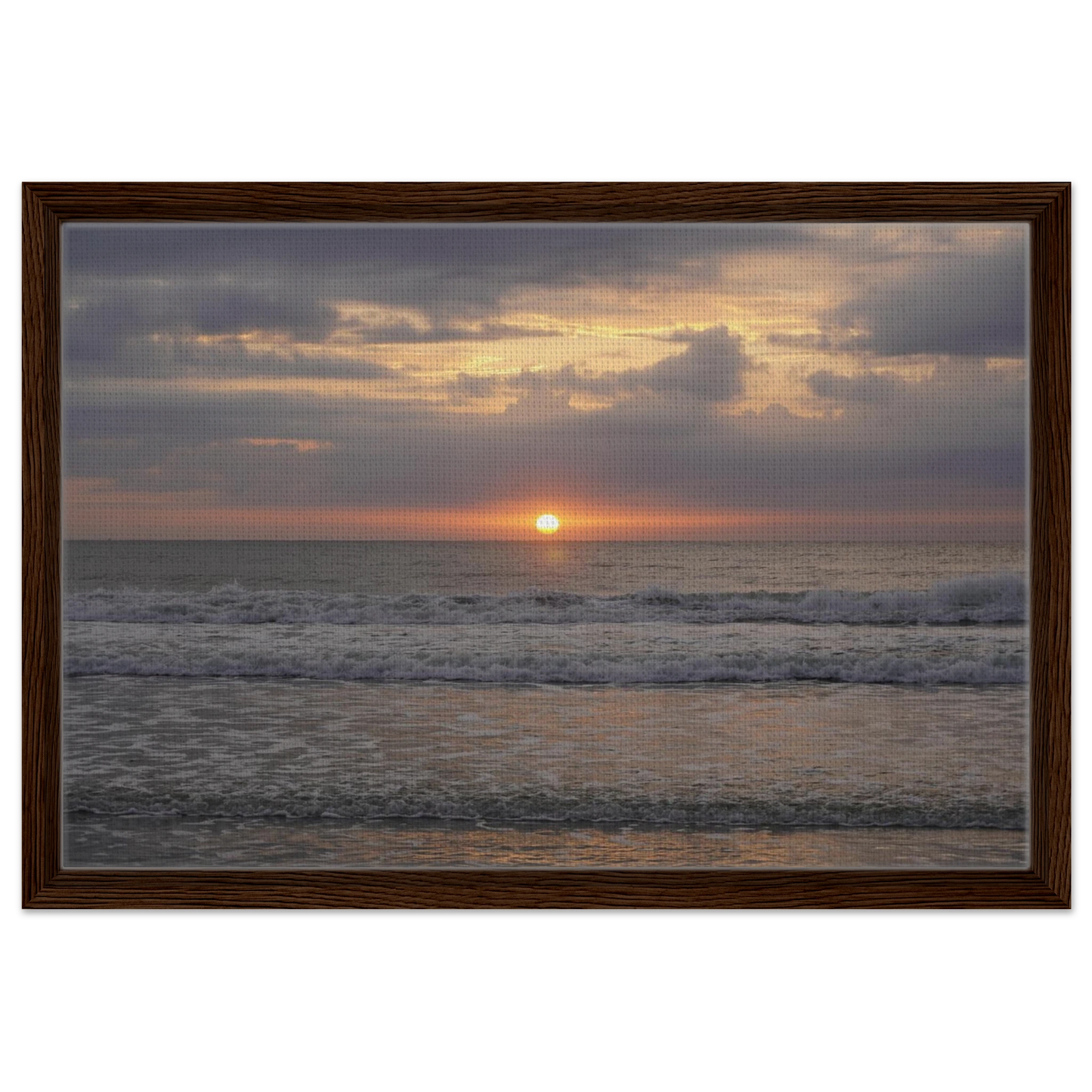 Soft sunrise over the Atlantic Ocean with gentle waves at Vilano Beach Florida.