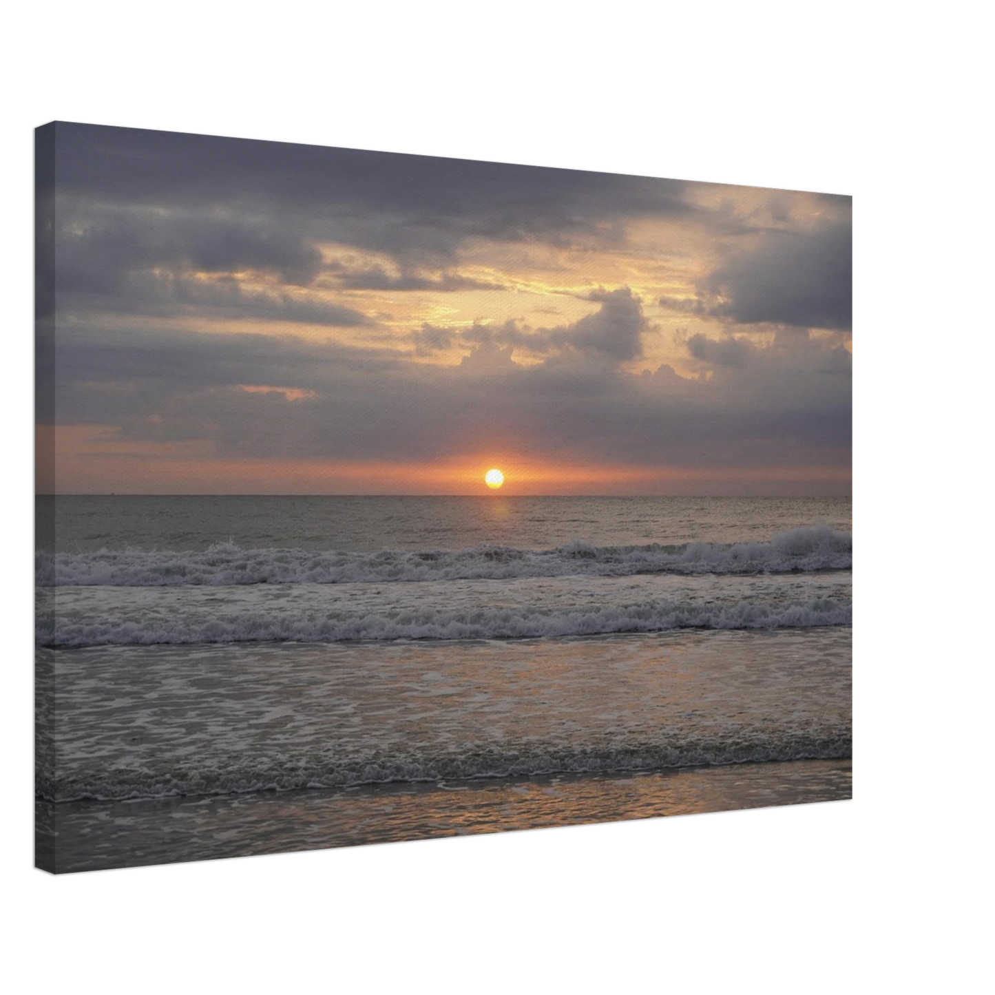 Soft sunrise over the Atlantic Ocean with gentle waves at Vilano Beach Florida.