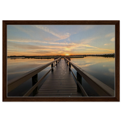 Wooden dock extending into a glowing salt water marsh at sunrise as premium coastal wall art.