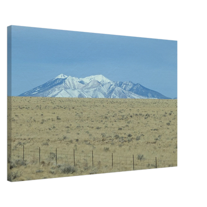 Snow-capped San Francisco Peaks rising above open Arizona plains as premium mountain wall art.