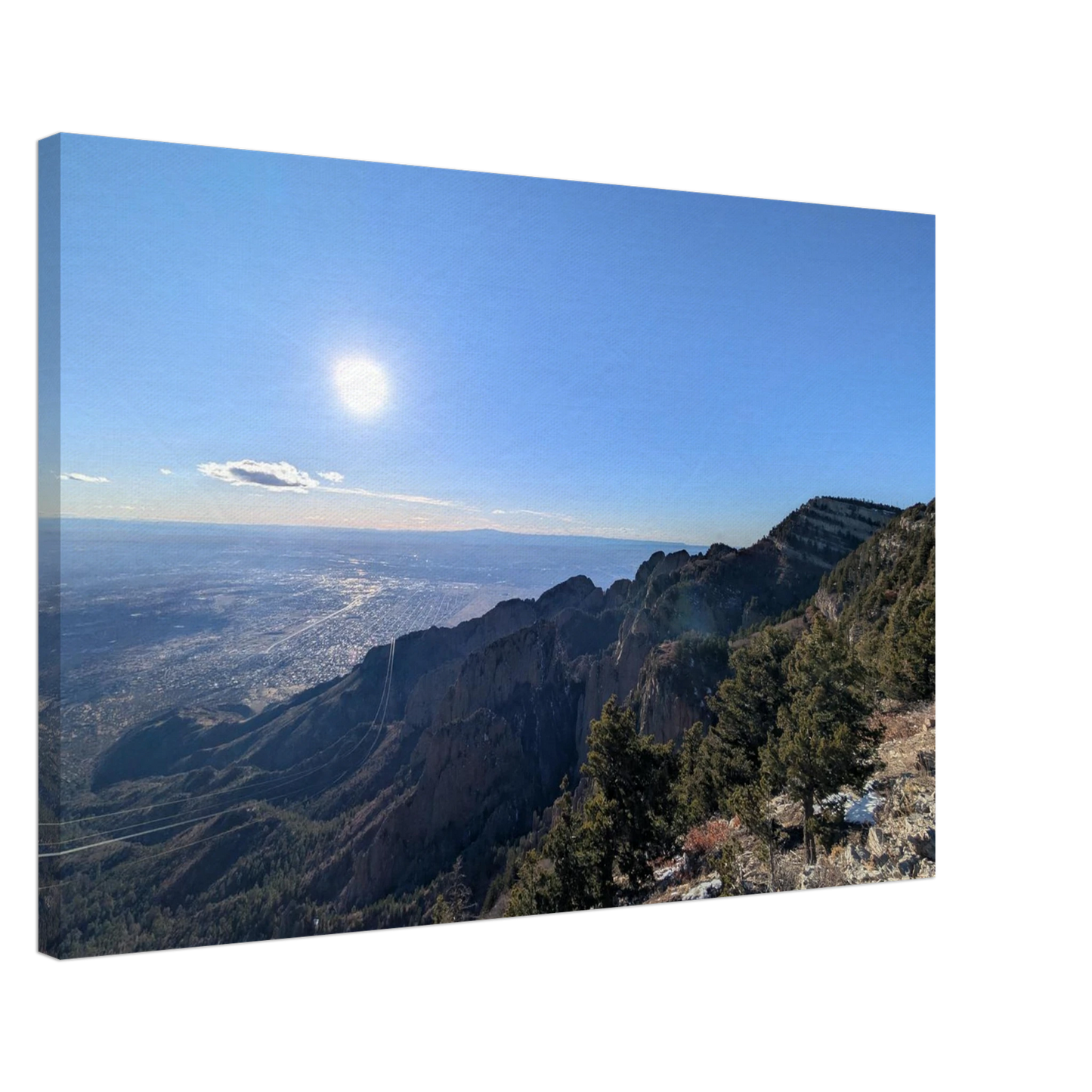 Panoramic view from Sandia Crest overlooking New Mexico's rugged mountains and high desert landscape.