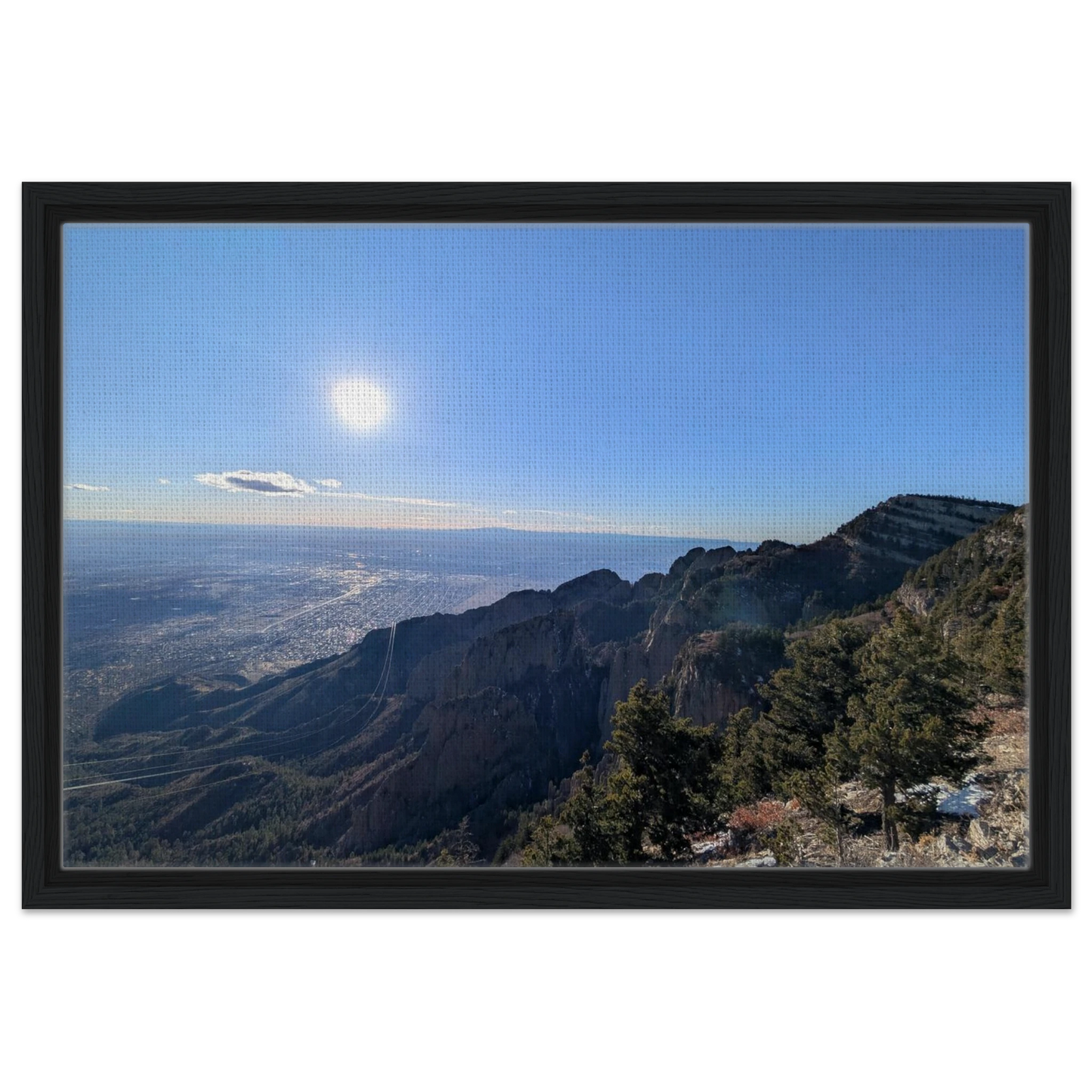 Panoramic view from Sandia Crest overlooking New Mexico's rugged mountains and high desert landscape.