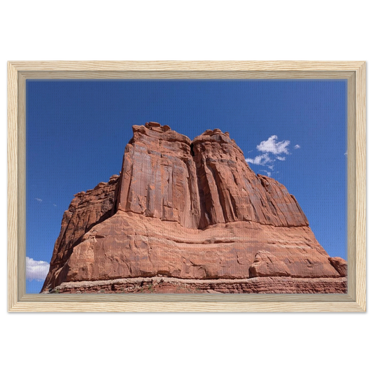 Sandstone tower in Arches National Park against blue sky as Southwest canvas wall art.