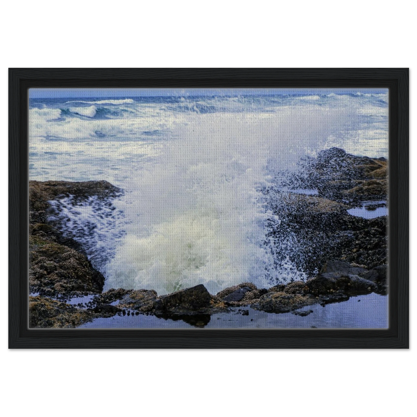 Thor's Well on the Oregon coast with crashing surf and rugged rocks as canvas wall art.